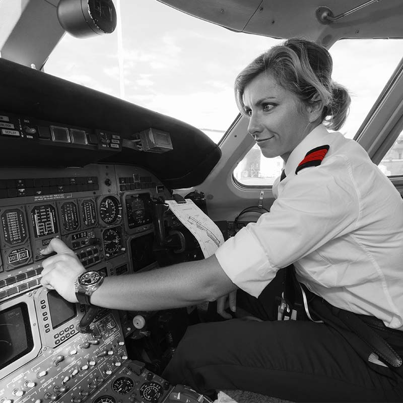 Woman airline pilot in cockpit