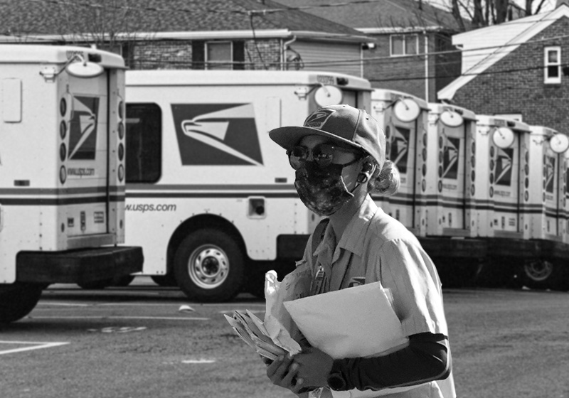 Mail Woman walking in front of mail trucks